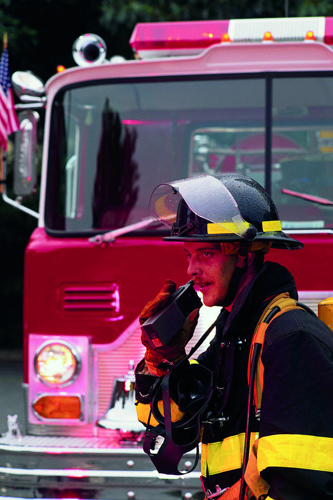 Fireman and Fire Engine at Station